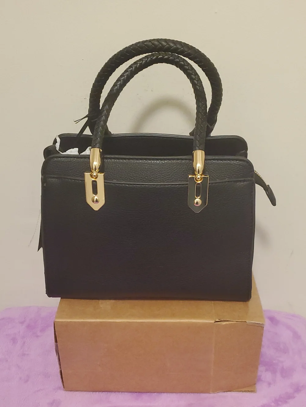 Structured Black Satchel with Braided Handles and Gold Accents